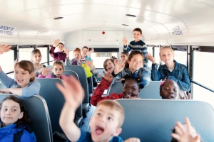 Students inside a school bus at the school's out