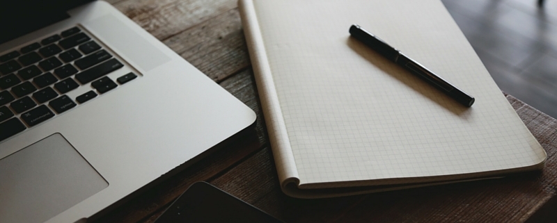 checklist notepad laptop
