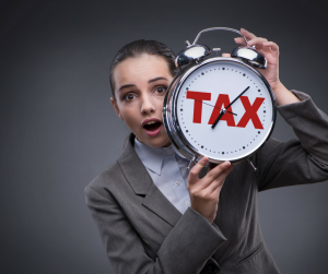woman hold a tax clock
