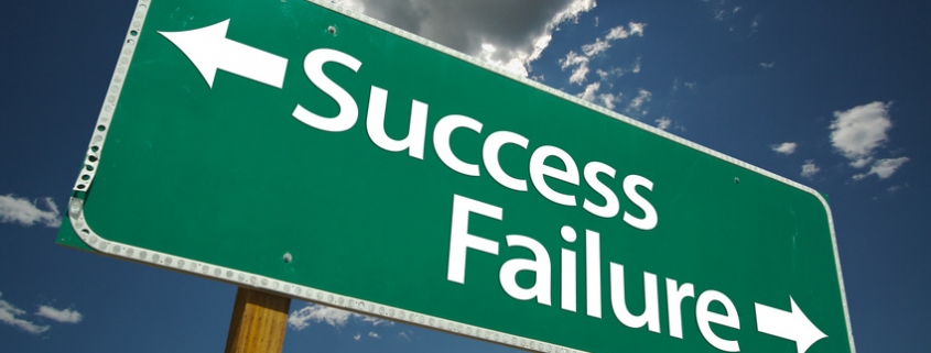 Success and Failure Road Sign with dramatic clouds and sky.