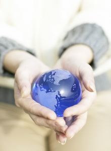 Woman Holding Small Globe