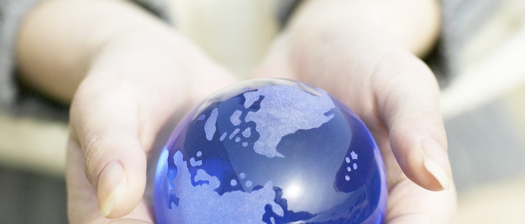 Woman Holding Small Globe