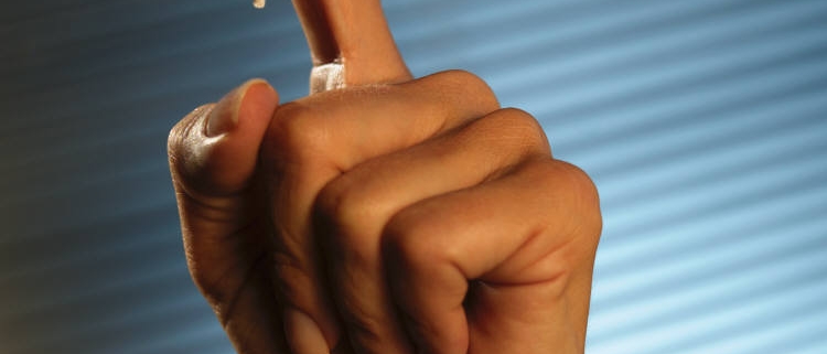 reminder string tied on a finger